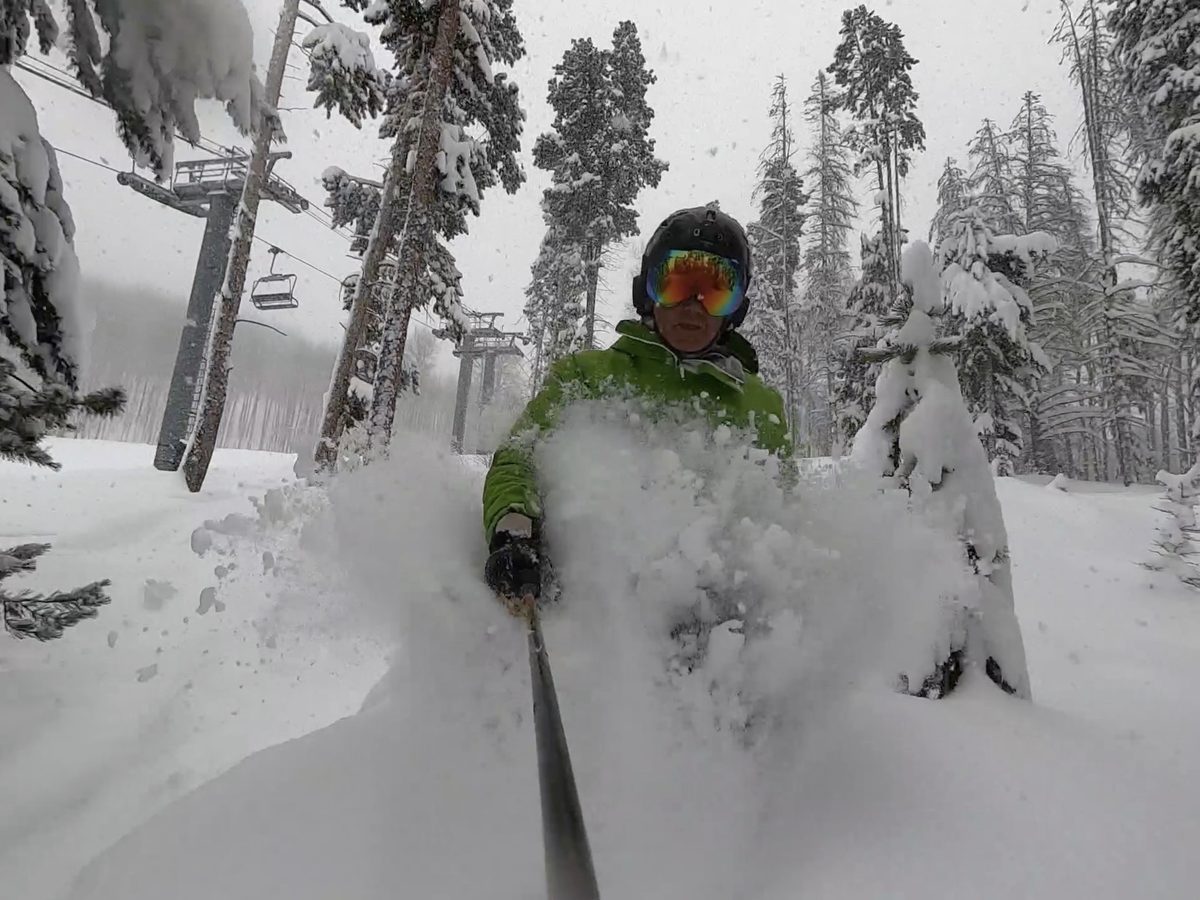 Richard W. Leslie skiing powder through the trees at a Colorado resort